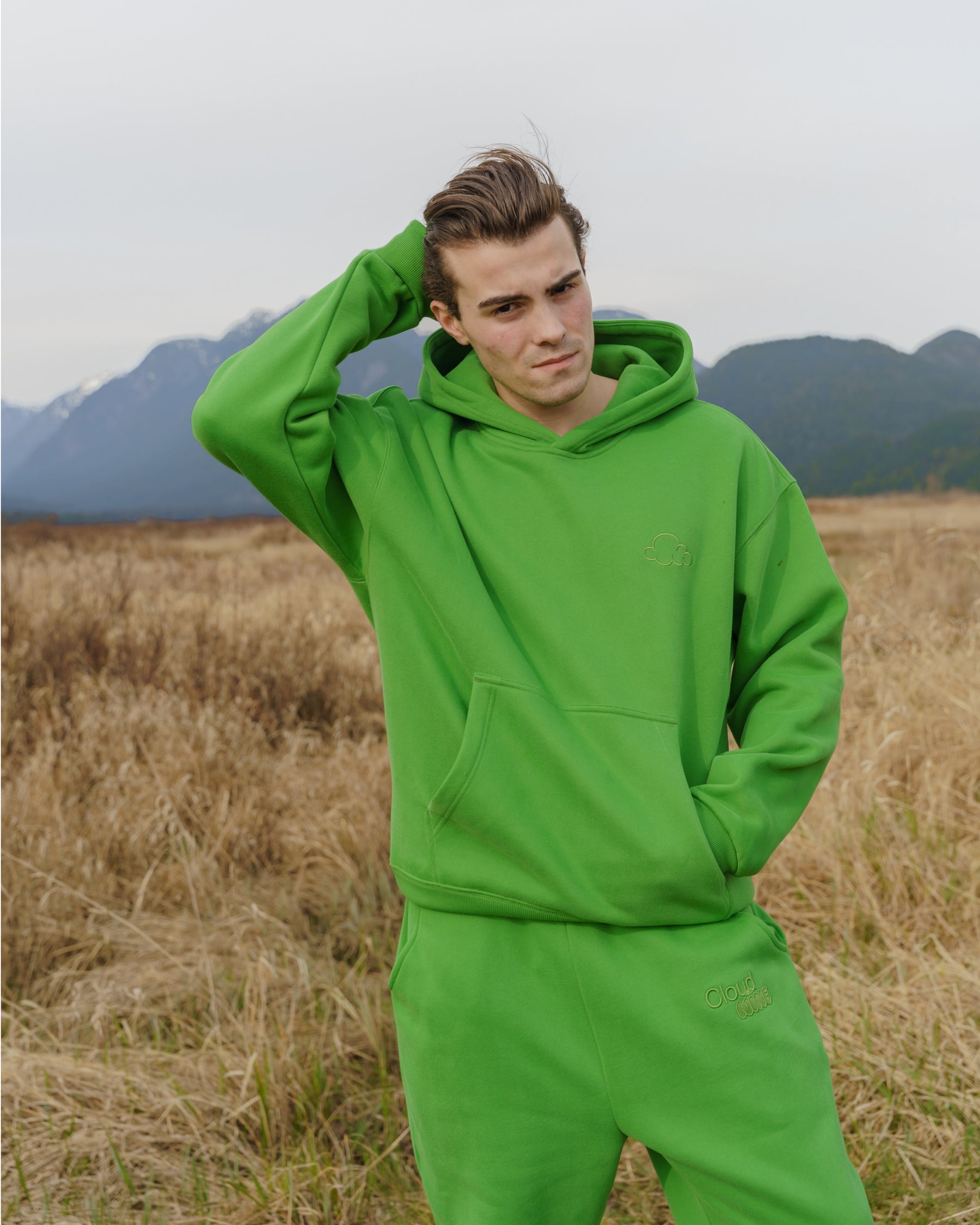 Cloud Hoodie in Green showing thumb holes and cuff details