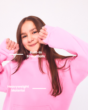 Kids Cloud pullover in pink showing built-in cuff stress balls and heavyweight material