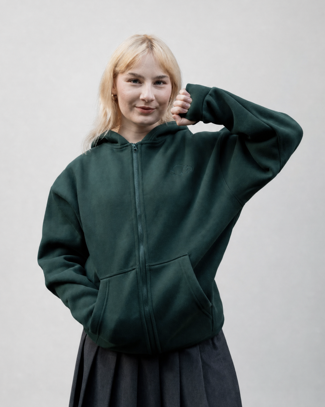 Grounding Zip-Up Hoodie in Forest Green – model squeezing stress ball