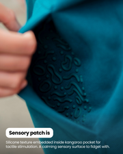 Close-up of the textured sensory patch inside the Grounding Zip-Up Hoodie pocket.