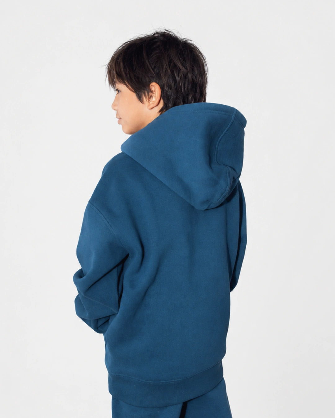 Soothe kids sweatpants in Denim Blue - Rear outfit view